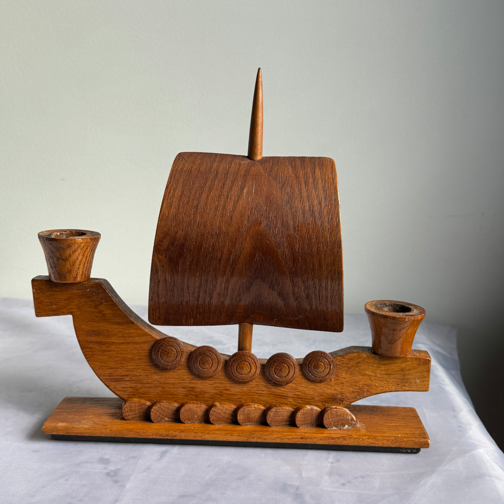 Vintage wooden Viking ship candle holder with curved sail, front view