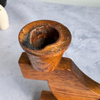 Close-up of candle cup with wax residue and darkening