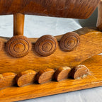 Detail of shields and oars with small chips and wear